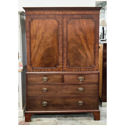 519 - AN EARLY 19TH CENTURY MAHOGANY LINEN PRESS, doors enclosing a fitted interior, drawers to base, brac... 