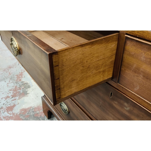 519 - AN EARLY 19TH CENTURY MAHOGANY LINEN PRESS, doors enclosing a fitted interior, drawers to base, brac... 