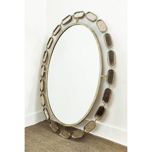 527 - OVAL WALL MIRROR, 122cm x 94cm, in a silvered metal frame with bevelled plate and a satellite border... 