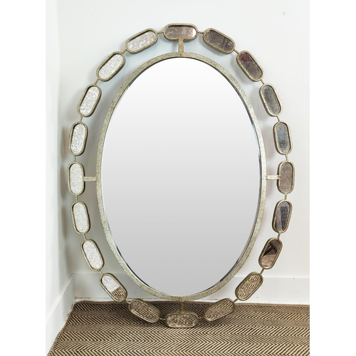 527 - OVAL WALL MIRROR, 122cm x 94cm, in a silvered metal frame with bevelled plate and a satellite border... 