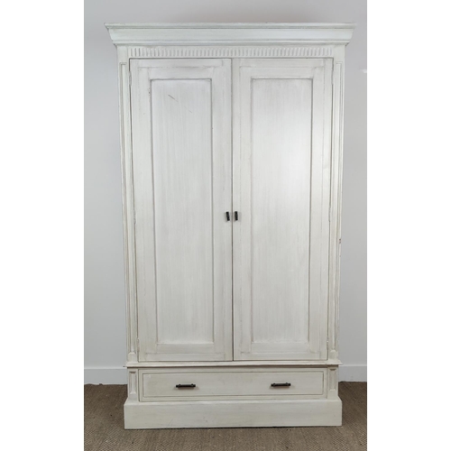 539 - OKA ARMOIRE, in a paint effect finish, with a pair of panelled doors, 126cm W x 61cm D x 215cm, encl... 