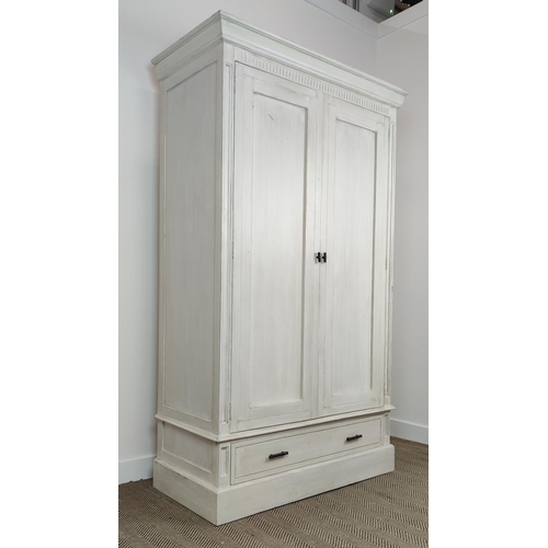 539 - OKA ARMOIRE, in a paint effect finish, with a pair of panelled doors, 126cm W x 61cm D x 215cm, encl... 