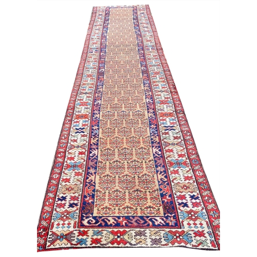 104 - ANTIQUE NORTH WEST PERSIAN SERAPI RUNNER, 400cm x 100cm.