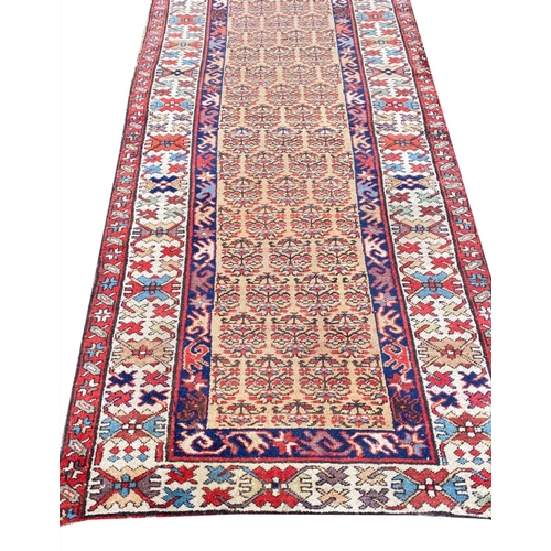 104 - ANTIQUE NORTH WEST PERSIAN SERAPI RUNNER, 400cm x 100cm.