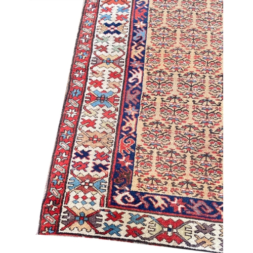 104 - ANTIQUE NORTH WEST PERSIAN SERAPI RUNNER, 400cm x 100cm.