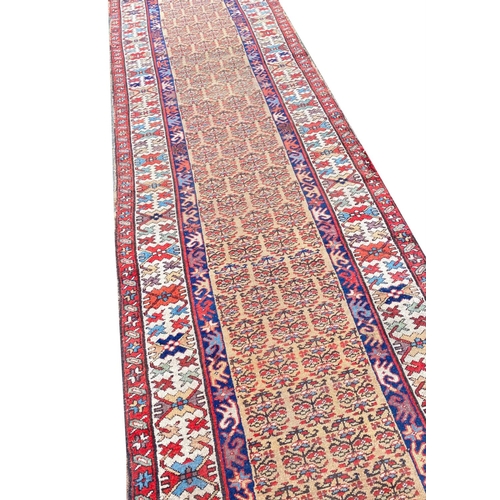 104 - ANTIQUE NORTH WEST PERSIAN SERAPI RUNNER, 400cm x 100cm.