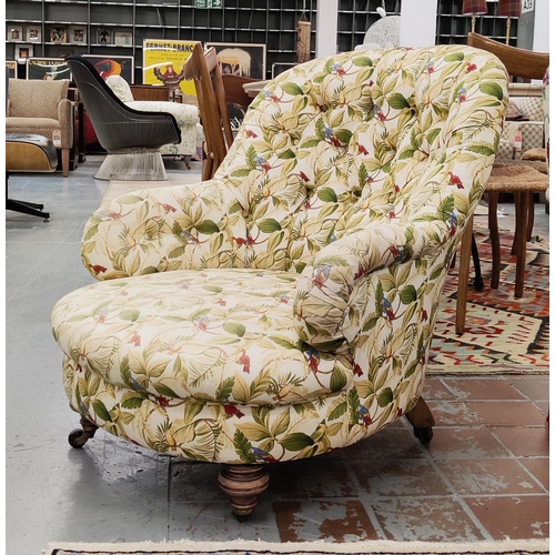 541 - ARMCHAIR, Victorian with deep buttoned botanical print upholstery and turned front supports.