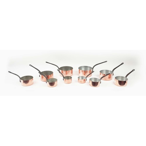 26 - BATTERIE DE CUISINE, two graduated sets of five, copper and iron. (10)