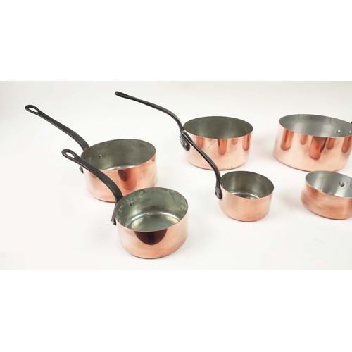 26 - BATTERIE DE CUISINE, two graduated sets of five, copper and iron. (10)