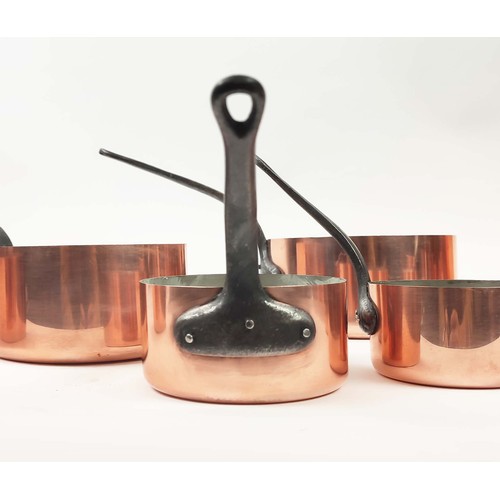 26 - BATTERIE DE CUISINE, two graduated sets of five, copper and iron. (10)