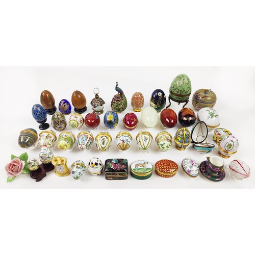 33 - A COLLECTION OF ENAMELLED EGG TRINKETS, mostly by Halcyon days enamels, plus various other boxes, eg... 