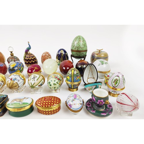 33 - A COLLECTION OF ENAMELLED EGG TRINKETS, mostly by Halcyon days enamels, plus various other boxes, eg... 