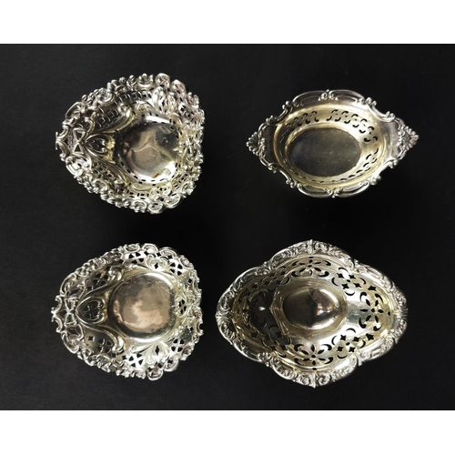 55 - SILVER SMALL DISHES, four pierced, and three items of Pewter. (7)