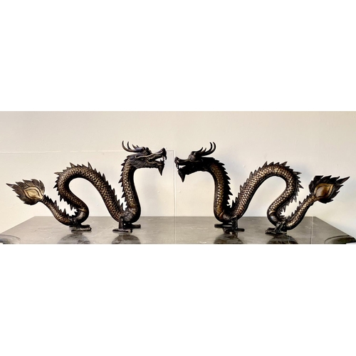 399 - CONTEMPORARY SCHOOL DRAGON SCULPTURES, a pair, Chinese style bronze, each 40cm H x 72cm W x 8cm D. (... 