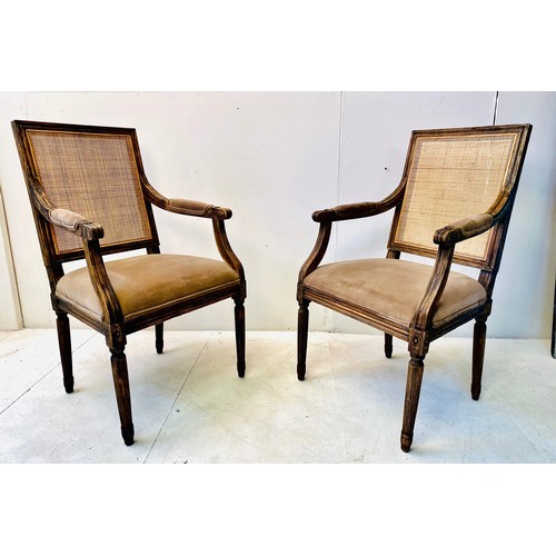 400 - FAUTEUILS, a pair, French oak with rattan backs and brown upholstery, 102cm H x 50cm W x 57cm D. (2)