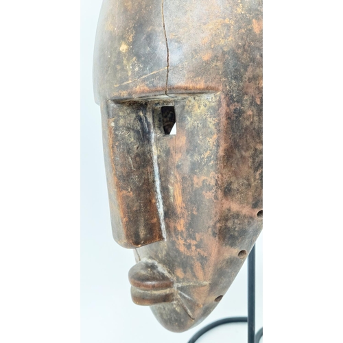 10 - A BOBO FING HELMET MASK- BURKINA FASO, along with a Kenyan beaded belt and pestle and mortar, mask 7... 