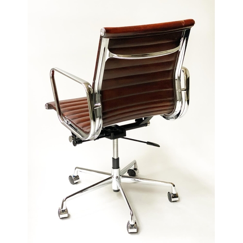 133 - REVOLVING DESK CHAIR, Charles and Ray Eames inspired, with ribbed hand finished tan brown leather se... 