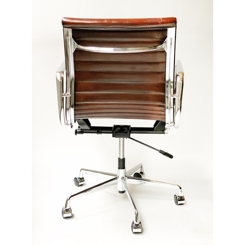 133 - REVOLVING DESK CHAIR, Charles and Ray Eames inspired, with ribbed hand finished tan brown leather se... 