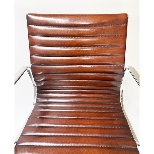 133 - REVOLVING DESK CHAIR, Charles and Ray Eames inspired, with ribbed hand finished tan brown leather se... 