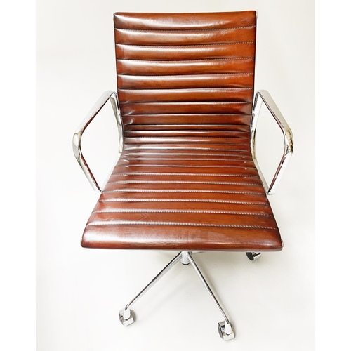 133 - REVOLVING DESK CHAIR, Charles and Ray Eames inspired, with ribbed hand finished tan brown leather se... 