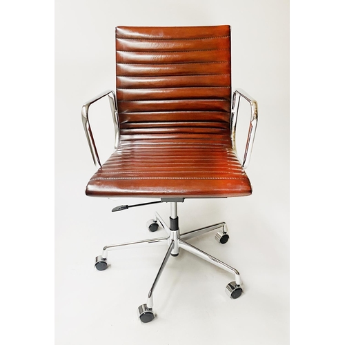 133 - REVOLVING DESK CHAIR, Charles and Ray Eames inspired, with ribbed hand finished tan brown leather se... 