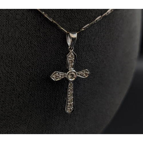 33 - AN 18CT WHITE GOLD DIAMOND SET CROSS PENDANT NECKLACE, the cross set with round brilliant cut diamon... 