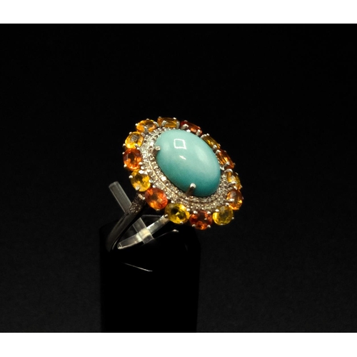 37 - A TURQUOISE AND FANCY COLOURED SAPPHIRE SET DRESS RING, the central cabouchon surrounded by diamonds... 