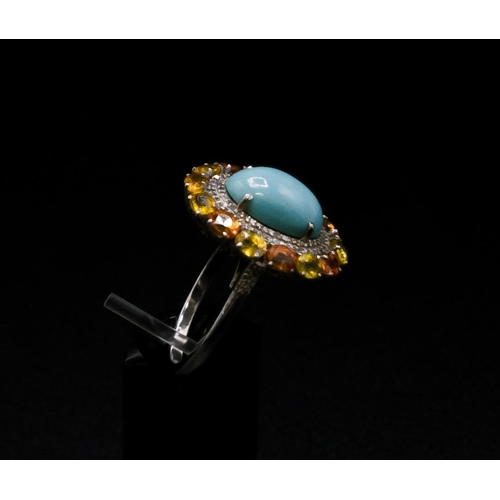 37 - A TURQUOISE AND FANCY COLOURED SAPPHIRE SET DRESS RING, the central cabouchon surrounded by diamonds... 