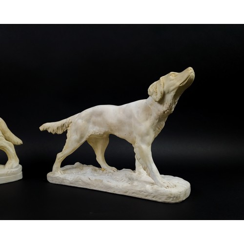 44 - TWO DOG FIGURES, plaster, one depicting a labrador and the other of a golden retriever,, largest6 27... 