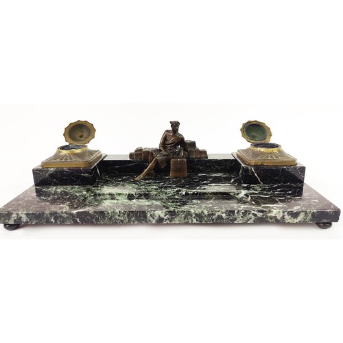 46 - AN ART DECO MARBLE AND BRONZE DESK SET, with two ink wells, and a central figure, with an inset pen ... 