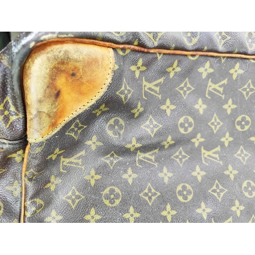 2 - LOUIS VUITTON SUITCASE SIRIUS 70, monogram canvas with leather trims and double top handles, brass h... 