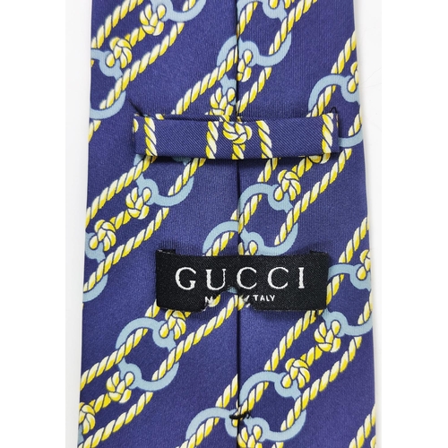 27 - HERMÈS SILK TIE, with box together with a Gucci silk tie, a René Chagal silk tie, a Georg Jensen sil... 