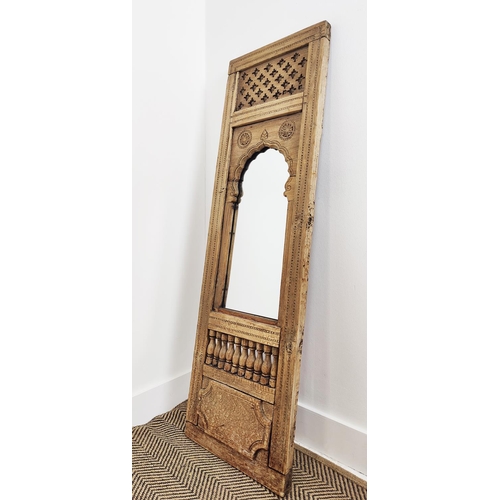 WALL MIRROR, in a wooden Indian carved panel, 40cm W x 135cm H.
