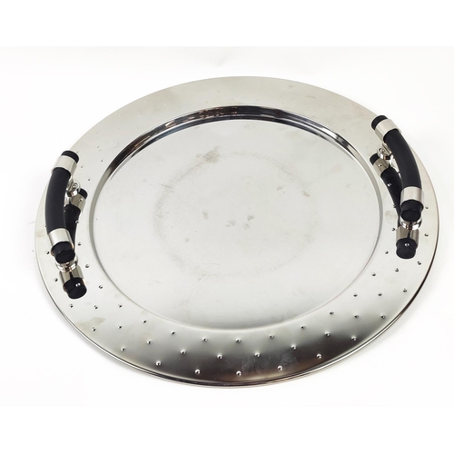 35 - ALESSI MEVASS ITALIAN STAINLESS STEEL SERVING TRAY, twin handled, 48cm diam.