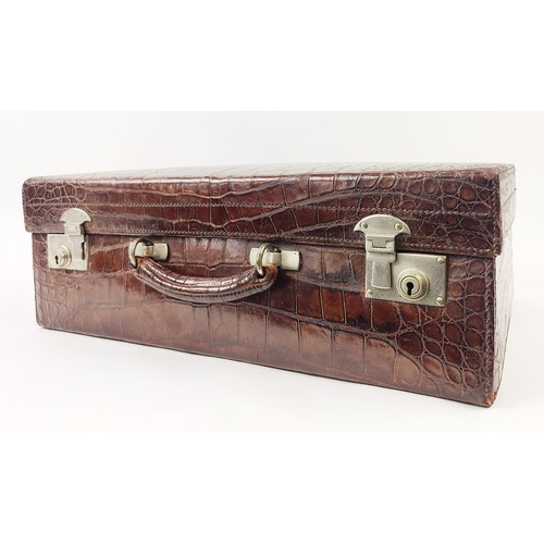 53 - CROCODILE SKIN SUITCASE, early 20th century, 51cm H x 34cm W x 17cm D.