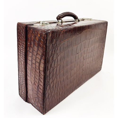 53 - CROCODILE SKIN SUITCASE, early 20th century, 51cm H x 34cm W x 17cm D.