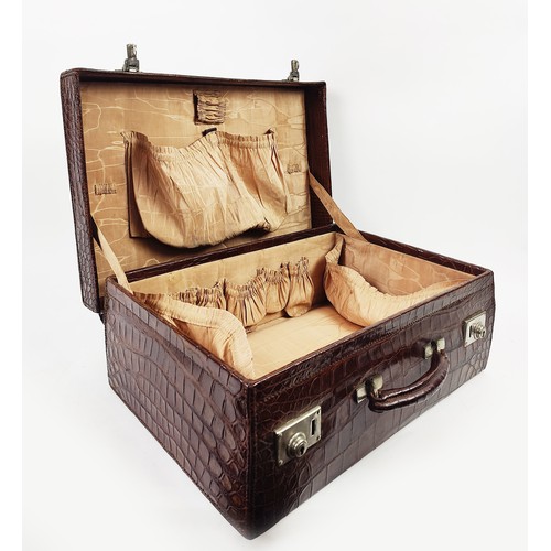 53 - CROCODILE SKIN SUITCASE, early 20th century, 51cm H x 34cm W x 17cm D.