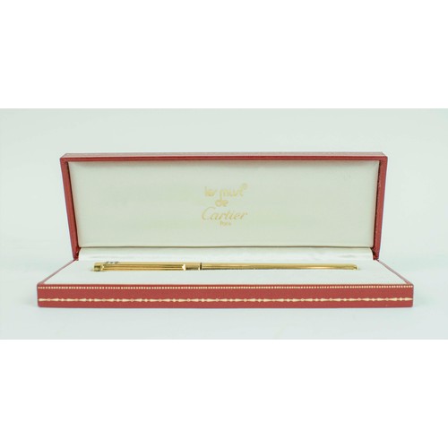 55 - A CARTIER GOLD PLATED BALLPOINT PEN, 1989, serial number 717560, Must De Cartier, complete with orig... 