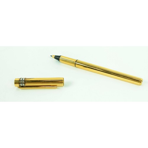 55 - A CARTIER GOLD PLATED BALLPOINT PEN, 1989, serial number 717560, Must De Cartier, complete with orig... 