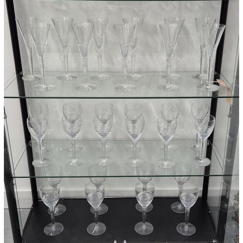 42 - JASPER CONRAN FOR STUART, DRINKING GLASSES, comprising eleven Champagne flutes, 26cm H, twelve white... 