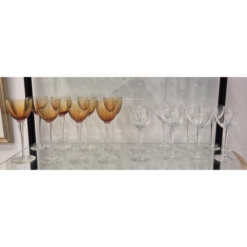 43 - SAINT LOUIS DRINKING GLASSES, comprising eight clear wine glasses, 20.5cm H and eight amber coloured... 