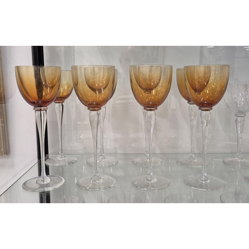 43 - SAINT LOUIS DRINKING GLASSES, comprising eight clear wine glasses, 20.5cm H and eight amber coloured... 