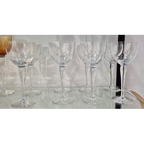 43 - SAINT LOUIS DRINKING GLASSES, comprising eight clear wine glasses, 20.5cm H and eight amber coloured... 