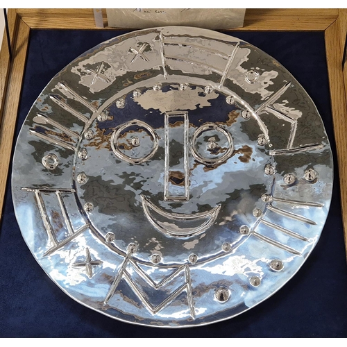 65 - PABLO PICASSO, 'Visage en forme d'horloge', 1956, repoussé silver, 42cm diam, stamped verso. (Subjec... 