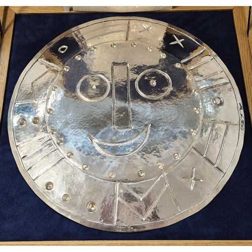 65 - PABLO PICASSO, 'Visage en forme d'horloge', 1956, repoussé silver, 42cm diam, stamped verso. (Subjec... 