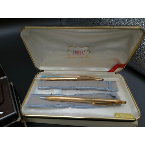 58 - A TIFFANY & CO SILVER BALLPOINT PEN, with an extra replaceable cartridge, a Christian Dior pencil, a... 