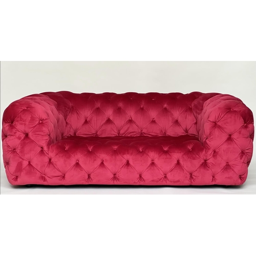 467 - SOFA, scarlet velvet all over deep button upholstered with rounded arms, 195cm W.