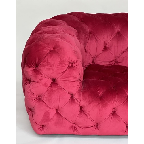 467 - SOFA, scarlet velvet all over deep button upholstered with rounded arms, 195cm W.