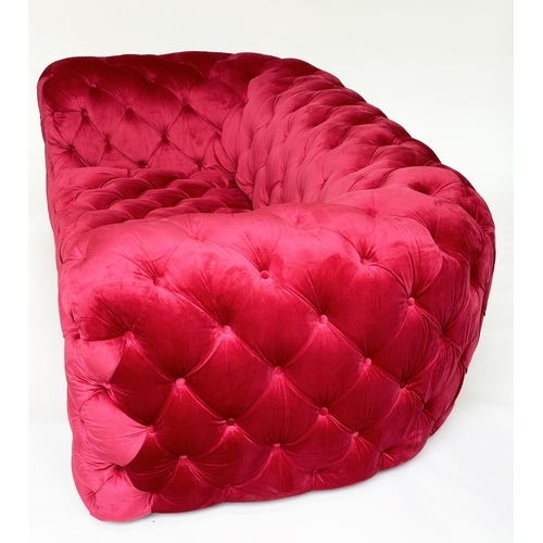 467 - SOFA, scarlet velvet all over deep button upholstered with rounded arms, 195cm W.