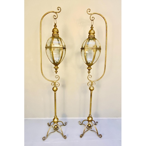 366 - LANTERNS ON STANDS, a pair, gilt metal, regency style, 163cm x 35cm x 30cm. (2)